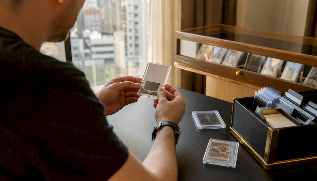 Collector putting rare redemption card in protective case