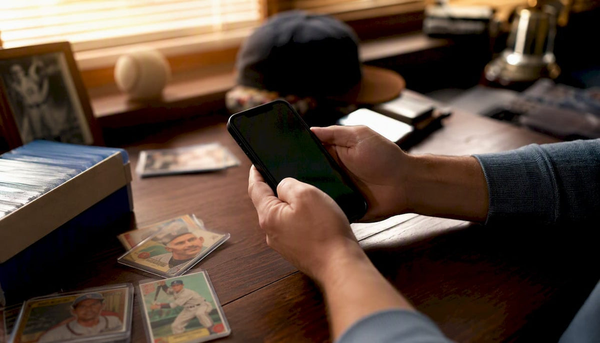 Hand holding smartphone with digital card