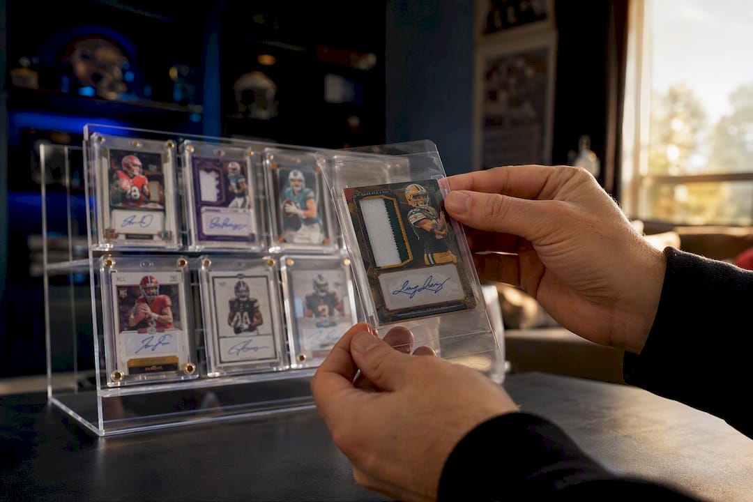 Collector placing rare card in protective sleeve